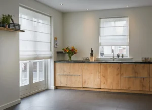 a kitchen with a sink and flowers