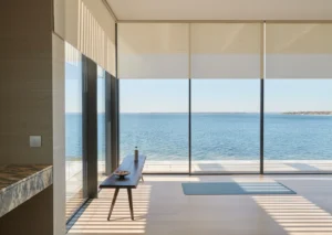 lutron automation - roller shades overlooking water